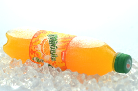 Bottle of Mirinda drink on ice cubesのeditorial素材