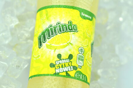 Bottle of Mirinda drink on ice cubesのeditorial素材
