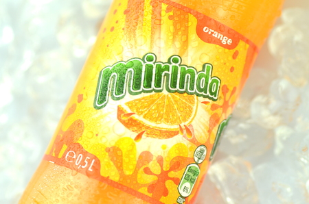 Bottle of Mirinda drink on ice cubesのeditorial素材