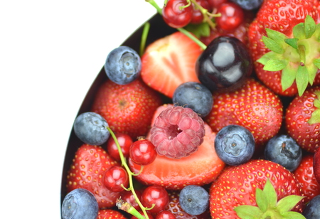 variety of soft fruits, strawberries, raspberries, cherries, blueberries, currants isolated on whiteの写真素材