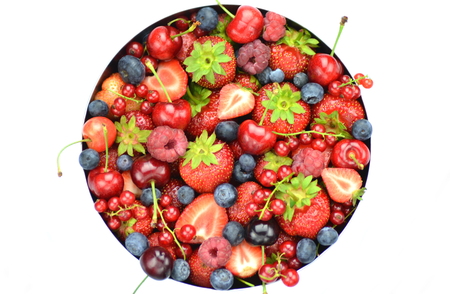variety of soft fruits, strawberries, raspberries, cherries, blueberries, currants isolated on whiteの写真素材