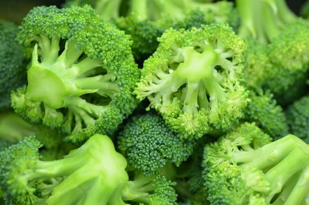 closeup of pieces of fresh broccoli in potの写真素材