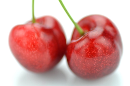closeup of ripe, fresh and sweet cherries isolated on white