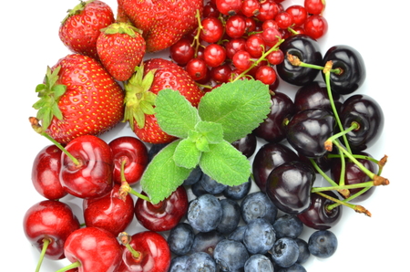 variety of soft fruits, strawberries, raspberries, cherries, blueberries, currants isolated on whiteの写真素材