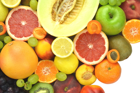 Variety of fresh and delicious fruits isolated on whiteの写真素材