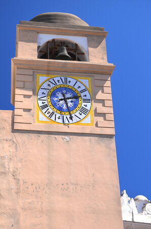 Beautiful antique tower clock on Capri island, Italyの写真素材