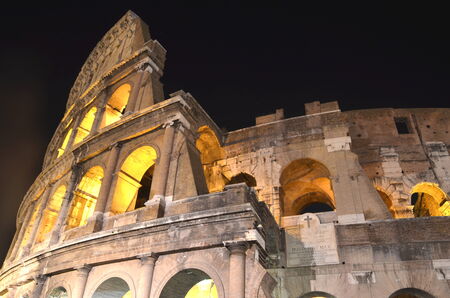 Majestic ancient Colosseum by night in Rome, Italyのeditorial素材