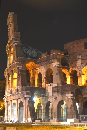 Majestic ancient Colosseum by night in Rome, Italyのeditorial素材