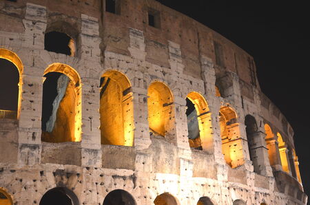 Majestic ancient Colosseum by night in Rome, Italyのeditorial素材