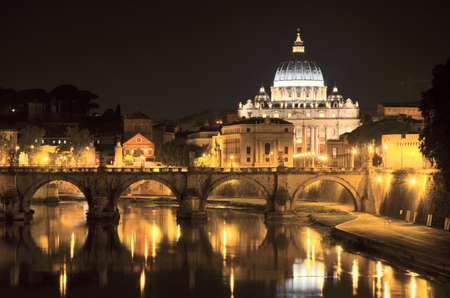 Monumental landscape of St. Peters Basilica over Tiber  at night  in Rome, Italyのeditorial素材