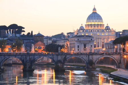 Picturesque landscape of St. Peters Basilica over Tiber  at sunset in Rome, Italyのeditorial素材