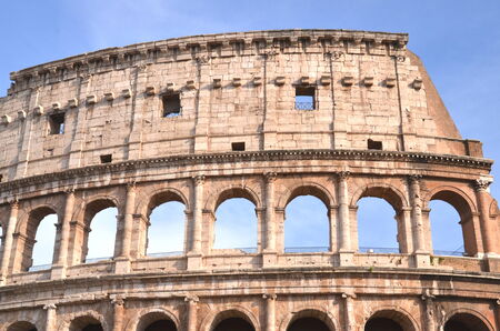 Monumental ancient Colosseum in Rome against blue sky, Italyのeditorial素材