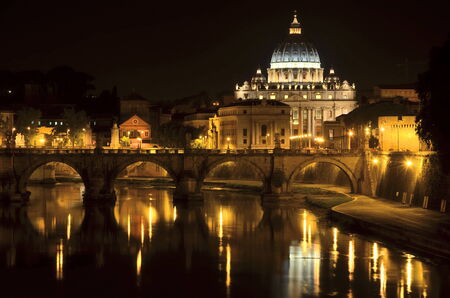 Monumental St. Peters Basilica over Tiber at night in Rome, Italyの写真素材