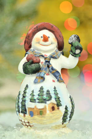 christmas decoration, figure of snowman against bokeh backgroundの写真素材