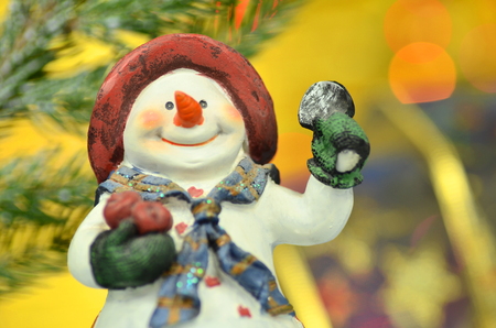 christmas decoration, figure of snowman against bokeh backgroundの写真素材