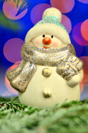 christmas decoration, figure of snowman against bokeh backgroundの写真素材
