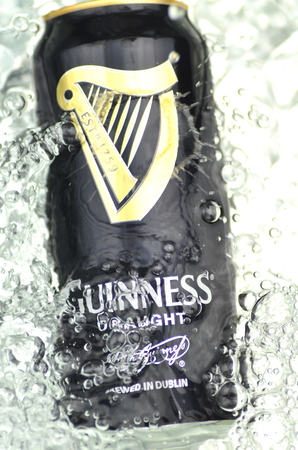 Guinness draught beer in splashed water.のeditorial素材