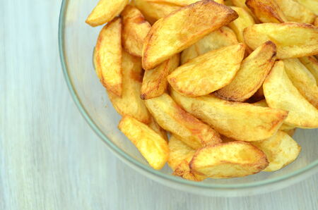 delicious fried potatoes in glass bowlの写真素材