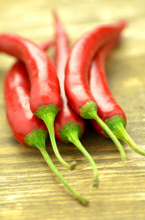 red hot chilli peppers on tableの写真素材