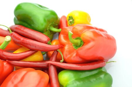 variety of raw peppers isolated on white backgroundの写真素材