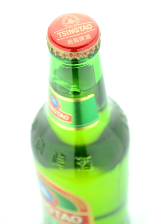 Tsingtao beer isolated on white backgroundのeditorial素材