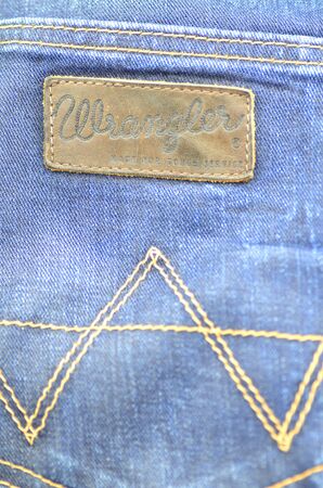 Closeup of Wrangler label on blue jeansのeditorial素材