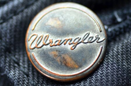 Closeup of a button Wrangler blue jeansのeditorial素材