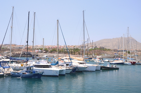 Boats and yachts in fishing harbor in Las Galletas on Tenerife islandのeditorial素材