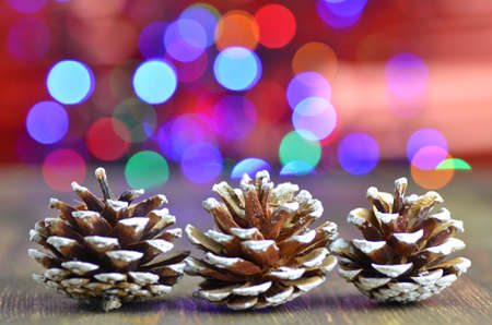 christmas decoration, decorative cones on magical bokeh backgroundの写真素材