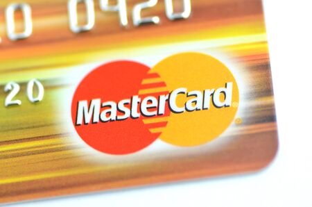 Closeup of MasterCard debit card isolated on white backgroundのeditorial素材
