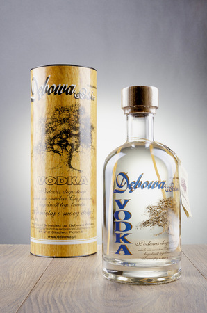 Debowa vodka with wooden handle isolated on a gradient background.のeditorial素材