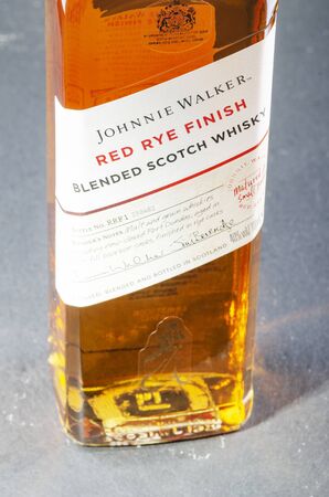 Johnnie Walker red rye finish blended whisky on gradient background.のeditorial素材