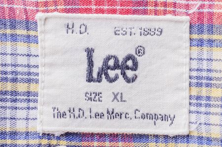 Closeup of Lee label on clothes. Lee is an American brand of denim jeans, first produced in 1889 in...