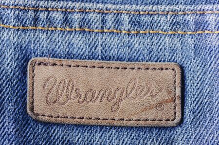 Closeup of Wrangler label on blue jeans.のeditorial素材