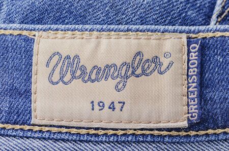 Closeup of Wrangler label on blue jeans.