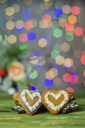 Delicious decorated Christmas cookies on bokeh backgroundの写真素材
