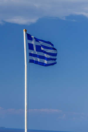 National flag of Greece waving against blue sky