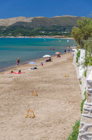 Picturesque golden sandy beach in Kalamaki situated on Laganas bay of Zakynthos island on Ionian Sea, Greece.の写真素材