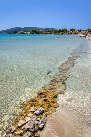 Picturesque golden sandy beach in Laganas situated on Laganas bay of Zakynthos island on Ionian Sea, Greece.のeditorial素材