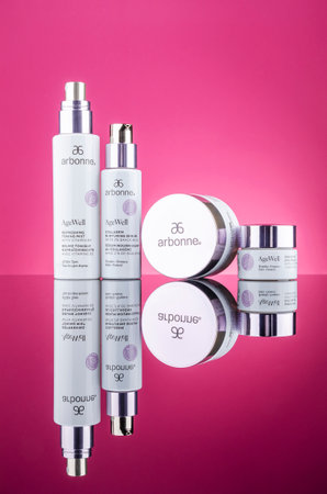Arbonne age well cosmetics isolated on gradient background. Arbonne is international multi-level marketing company founded in 1980 in the United States by Norwegian entrepreneur Petter Morck.のeditorial素材