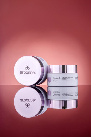 Arbonne age well cosmetics isolated on gradient background. Arbonne is international multi-level marketing company founded in 1980 in the United States by Norwegian entrepreneur Petter Morck.のeditorial素材