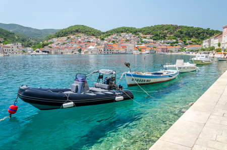 Picturesque bay of Pucisca. Pucisca lies at the end of deep natural bay on the northern coast of Brac island in Croatia.のeditorial素材