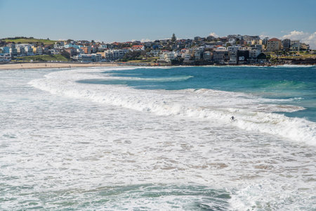 Picturesque golden sandy Bondi Beach in Sydney. Bondi beach is the perfect place for surfers due to...