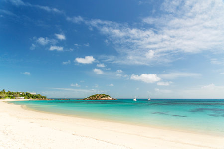 Picturesque tropical sandy Anchor Beach with turquoise water on Lizard Island. Lizard Island is located on Great Barrier Reef in north-east part of Queensland, Australiaの写真素材