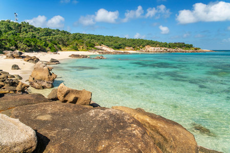 Picturesque tropical golden sandy Sunset Beach with turquoise water on Lizard Island, Australia. Lizard Island is located on Great Barrier Reef in north-east part of Queenslandの写真素材