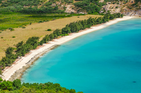 Picturesque aerial view on tropical sandy Watsons Beach with turquoise water on Lizard Island,...