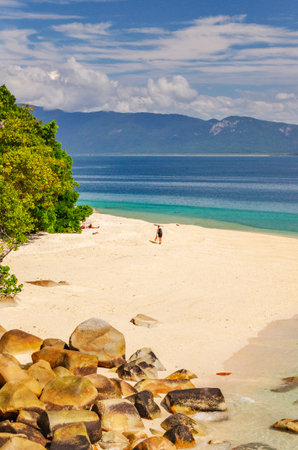Picturesque tropical beach with boulders and turquoise water on Fitzroy Island. It is a continental island southeast of Cairns, Queensland, Australia.の写真素材