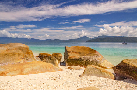 Picturesque tropical beach with boulders and turquoise water on Fitzroy Island. It is a continental island southeast of Cairns, Queensland, Australia.の写真素材