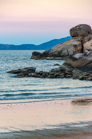 Picturesque golden sandy Alma Beach with granite boulders and turquoise water on Magnetic Island, Queensland, Australia. It is a holiday destination 8 km offshore of Townsville.の写真素材