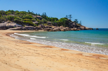 Picturesque golden sandy Alma Beach with granite boulders and turquoise water on Magnetic Island, Queensland, Australia. It is a holiday destination 8 km offshore of Townsville.の写真素材
